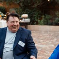 Two men sitting at table talking